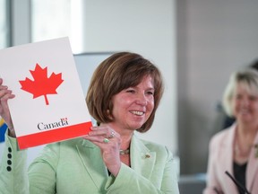 B.C. Minister of Mental Health and Addictions Sheila Malcolmson holds a copy of exemption documents in Vancouver on Tuesday, May 31, 2022, after British Columbia was granted authority to decriminalize possession of some hard drugs for personal use. 2022.