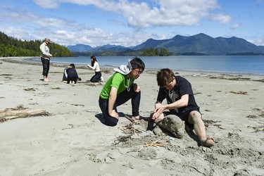 Students from West Point Grey Academy work on fire-making skills on the beach near the Cedar Coast Field Station on Vargas Island near Tofino, B.C. The station offers researchers, students and others the opportunity to live off-grid.