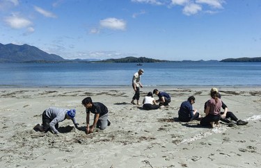 Students from West Point Grey Academy work on fire-making skills on the beach near the Cedar Coast Field Station on Vargas Island near Tofino, B.C. The station offers researchers, students and others the opportunity to live off-grid.