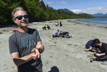 West Point Grey Academy teacher Tom Harding (left) watches students work on a project near the Cedar Coast Field Station on Vargas Island near Tofino, B.C. The station offers researchers, students and others the opportunity to live off-grid.