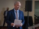 Premier John Horgan makes his announcement at a downtown hotel in Vancouver on Tuesday.