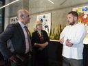 Minister of Municipal Affairs Nathan Cullen (left) chats with Natalie Jatskevich of the Ukrainian Canadian Congress and Kozak Eatery and Bakery co-owners Sergiy Kuznetsov after a government announcement to support Ukrainian citizens arriving in B.C. on June 29, 2022. 