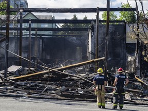 Vancouver, BC: JUNE 30, 2022 - Vancouver firefighters fought a stubborn blaze late Wednesday that destroyed the Value Village department store on E. Hastings Street in Vancouver, BC.  By Thursday morning June 30, 2022 they were still pouring water on hot spots.  (Photo by Jason Payne / PNG) (For story by reporter) [PNG Merlin Archive]