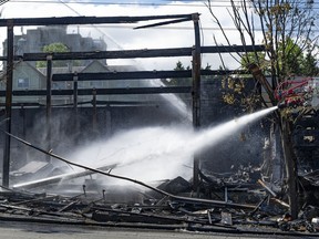 Vancouver firefighters fought a stubborn blaze late Wednesday that destroyed the Value Village department store on E. Hastings Street in Vancouver, BC.  By Thursday morning, June 30, 2022, they were still pouring water on hot spots.Photo by Jason Payne / PNG.
