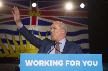 BC NDP Leader John Horgan waves to the crowd at NDP Headquarters in Vancouver, May, 10, 2017.