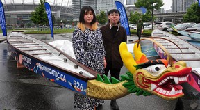 Katharine Meng-Yuan Yi and Sean Cao of the Bagua Artist Association with their newly designed dragon boat at the unveiling at False Creek in Vancouver on June 9.