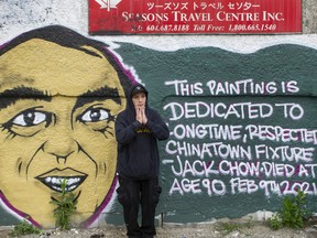 Downtown Eastside artist Smokey D with his mural dedicated to Jack Chow.