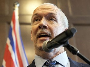 B.C. Premier John Horgan speaks during a media scrum