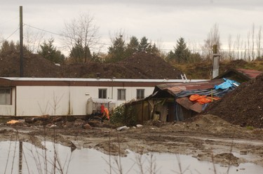 Feb. 7, 2002: Police take over a pig farm construction site on Dominion street, in search for missing women from Downtown Eastside. Robert Pickton's trailer at the back of the site.