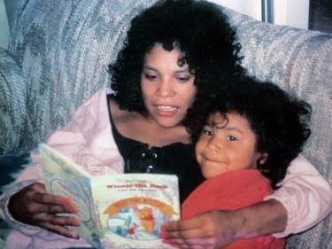 Sarah de Vries reading to her four year old daughter Jeannie, one of her two children.