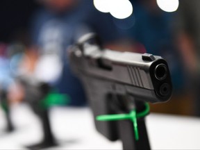 In this file photo taken on May 28, 2022 Glock Ges.m.b.H. pistols are displayed during the National Rifle Association (NRA) Annual Meeting at the George R. Brown Convention Center, in Houston, Texas.