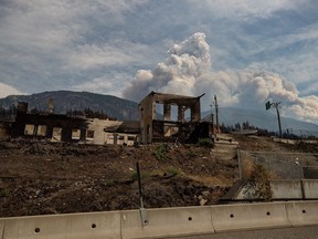 A property destroyed by the Lytton Creek wildfire is shown in Lytton, B.C., on Sunday, August 15, 2021. British Columbia's public safety minister says he expects many houses and the municipal infrastructure of wildfire-ravaged Lytton to be rebuilt by this time next year.