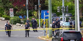 Police and paramedics respond to a bank robbery at the Bank of Montreal at Shelbourne and Pear streets Tuesday where multiple people were injured in a shootout.