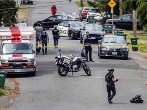 Police and paramedics respond to a bank robbery at the Bank of Montreal at Shelbourne and Pear streets Tuesday where multiple people were injured in a shootout.