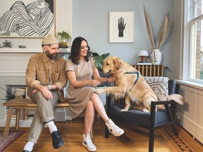 Anisa Musmary and Paul Irwin are pictured with their dog Norman. The couple are the co-founders of the Vancouver-based brand Wanderruff.