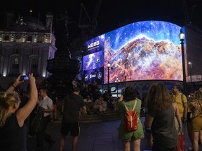 A general view of the broadcast of NASA's first images from James Webb Space Telescope to screens in Picadilly Circus on July 12, 2022 in London, England. The imagery from the James Webb Space Telescope was also broadcast to screens in Times Square as part of a global collaboration between Landsec and NASA.
