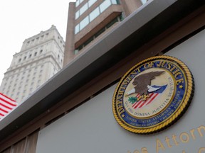 The seal of the United States Department of Justice is seen on the building exterior of the United States Attorney's Office of the Southern District of New York in Manhattan, New York City, U.S., August 17, 2020.