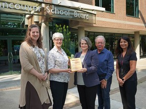 Vancouver school district staff receive a Living Wage plaque from First Call B.C. (left to right): Superintendent Helen McGregor, board chair Janet Fraser, First Call B.C. manager Helesia Luke, secretary treasurer David Green and project manager Dal Bhatti.