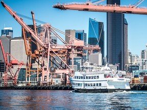 Like Vancouver, Seattle's waterfront is a mixture of residential and office towers and container cranes.