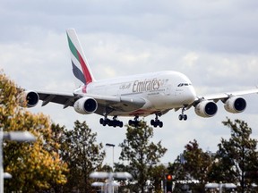 An Emirates A380 aircraft lands at London Heathrow Airport.