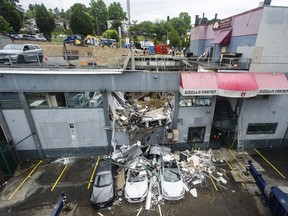 Emergency services were called to collapsed parking garage roof at a business on E. Broadway near Rupert Street in Vancouver Thursday.