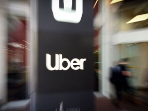 An Uber logo is seen outside the company's headquarters in San Francisco, California on May 8, 2019.