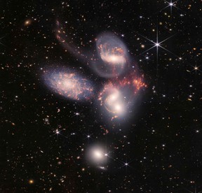This image released by NASA on July 12, 2022, shows Stephans Quintet captured by the James Webb Space Telescope (JWST), a visual grouping of five galaxies, in a new light. This enormous mosaic is JWSTs largest image to date, covering about one-fifth of the Moons diameter. It contains over 150 million pixels and is constructed from almost 1,000 separate image files. - The JWST is the most powerful telescope launched into space and it reached its final orbit around the sun, approximately 930,000 miles from Earths orbit, in January, 2022. The technological improvements of the JWST and distance from the sun will allow scientists to see much deeper into our universe with greater detail. (Photo by Handout / NASA / AFP)