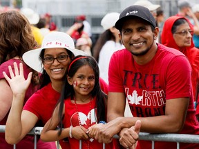 People gather to attend the Canada Day ceremony in Ottawa, Ont.