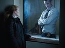 Mireille Enos as Sarah Linden and Joel Kinnaman as Stephen Holder in The Killing.