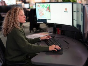 Call operator at work in E-Comm's main dispatch center in Vancouver.  E-Comm staff are the first point of contact for 911 dialers, transferring calls to the appropriate police, fire, and ambulance dispatchers.