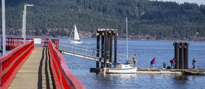 A sail passes the public wharf in Fernwood on Salt Spring Island.  Some Salt Spring businesses are struggling to attract and retain staff due to a severe housing shortage.