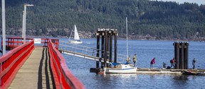 A sail passes the public wharf in Fernwood on Salt Spring Island. Some Salt Spring businesses are struggling to attract and retain staff due to a severe housing shortage.
