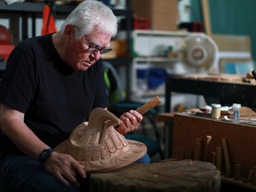 First Nations artist Richard Hunt began carving at the age of 13 now at 71 he continues to hone his skills as he works on his latest piece the Sun Mask using red cedar to create his one of a kind artwork at his studio in Victoria on Thursday, June 30, 2022.