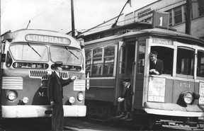 Uncredited and undated province photo of the Lonsdale streetcar and a bus meeting in North Vancouver. Stamped September 28 on the back, it could be from 1947. There is a Vancouver Sun ad on the front of the tram that says