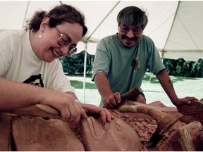 August 25, 1998, Vancouver. Norman Tait, and his student, Lucinda Turner (left) work a totem pole on the PNE site.