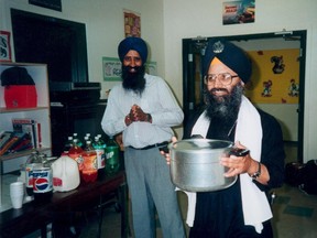 Ripudaman Singh Malik serves up something at Khalsa school in this 1995 file picture.