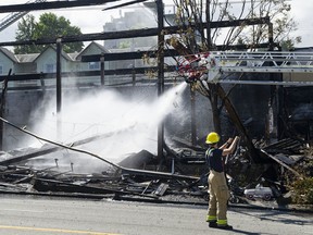 Vancouver firefighters battled a stubborn fire Wednesday night that destroyed the Value Village department store on E. Hastings Street in Vancouver.  By Thursday morning, June 30, 2022, they were still pouring water into the hot spots.