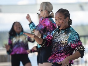 Members of Mom Bop will perform on the Kid's Stage on Friday.  Several thousand people soaked up the sun and took part in the Canada Day festivities in and around Canada Place and the Vancouver Convention Center in Vancouver, Friday, July 1.
