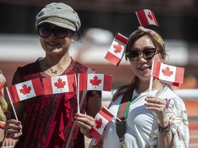 Several thousand people basked in the sun and participated in Canada Day festivities in and around Canada Place and the Vancouver Convention Center in Vancouver on Friday, July 1.