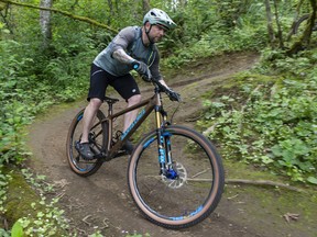 Yoshia Burton, president of the Abbotsford Trail Development Society and vice-president of the Fraser Valley Mountain Bike Association, on the Total Sanity trail on McKee Peak July 8. Trail users want to see trails saved when the mountain is eventually developed.