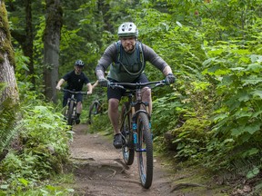 Mountain bikers enjoy the trails at McKee Peak in Abbotsford. The land is privately owned and is scheduled for development.