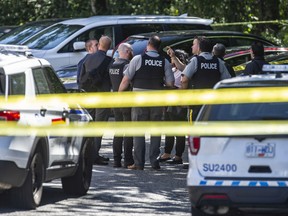 Various police agencies investigate the shooting death of Ripudaman Singh Malik at 8236 128th Street in Surrey, B.C. Thursday morning July 14, 2022. Malik, a well-known Surrey businessman, was acquitted in 2015 in the Air India Bombing, which killed hundreds of people in 1985.