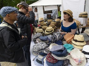 Jenna Johnson, of Cappelleria Bertacchi, on Jericho Beach in Vancouver on Saturday as a crowd of people took part in the 45th Annual Vancouver Folk Festival.