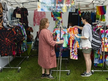 Spirits were not dampened by looming rain clouds at Jericho Beach in Vancouver, BC Saturday, July 16, 2022 as crowds of people took part in the 45th annual Vancouver Folk Festival.  Musicians, vendors and food trucks entertained the crowds at the family-friendly event.