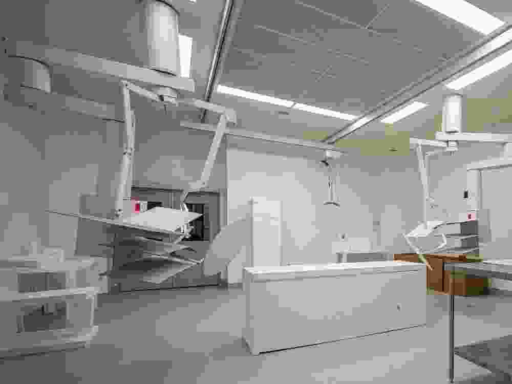 A full-sized mock-up of a future Burnaby Hospital operating room, with a Styrofoam bed and cardboard light booms.