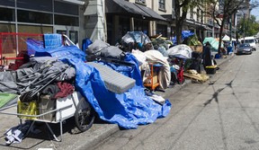 Tents line the sidewalk on East Hastings Street in Vancouver on Tuesday.