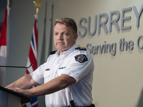 Assistant Commissioner and RCMP Surrey Detachment Officer Brian Edwards announces the arrests at a press conference in Surrey on Wednesday.