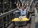 Postmedia reporter Derrick Penner (riding the first car) on the wooden roller coaster at Playland.  The iconic Coaster, in use since 1958, has recently undergone a retrofit.
