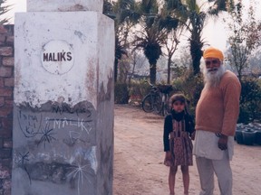 Tenants on the Malik family estate in Ferozpur, Punjab enter the front gate.
