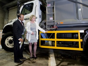 Montreal officials attend a news conference about the installation of side guards on trucks in May 2012.